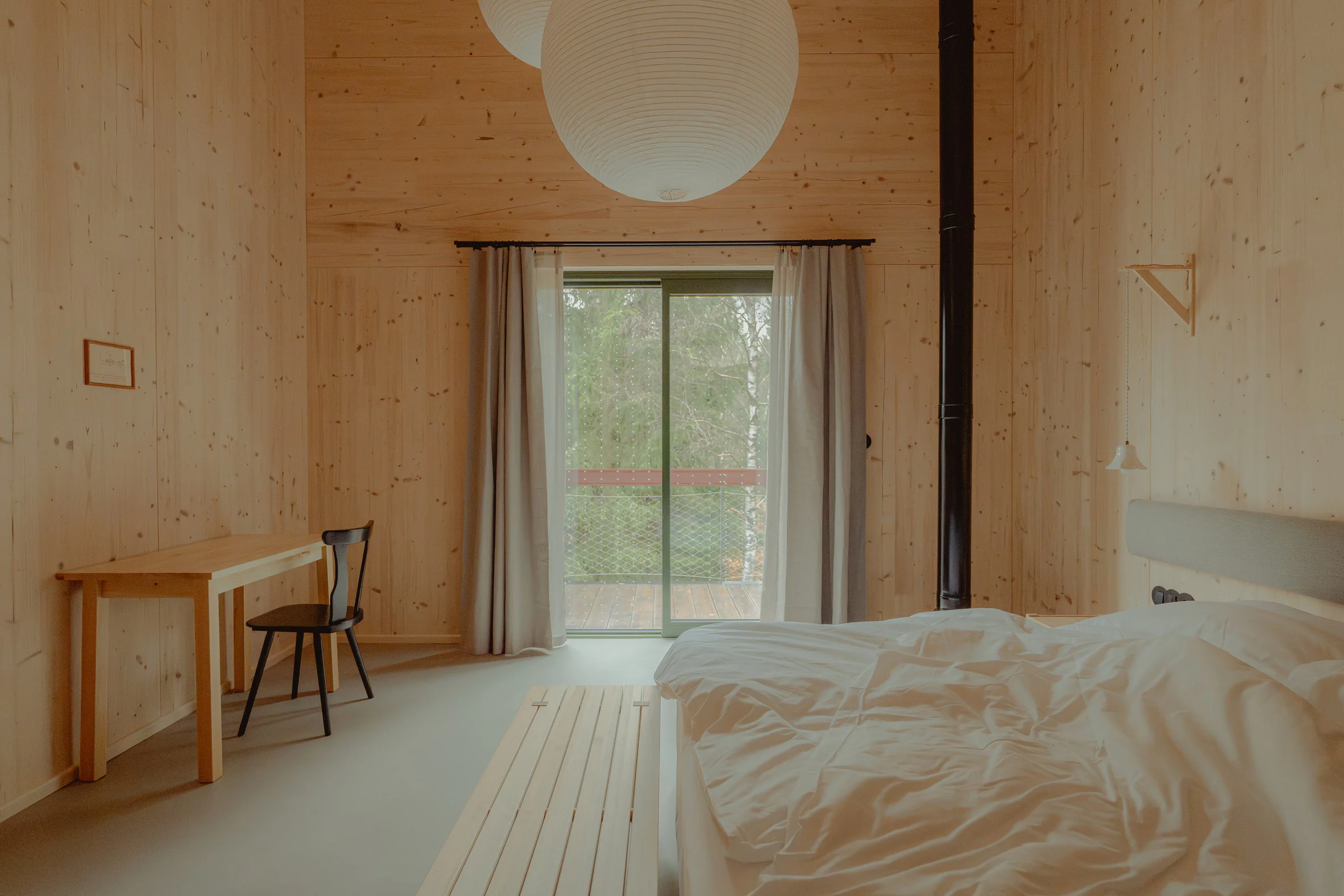 Interior bedroom of a cabin by Kuba Woźniczka